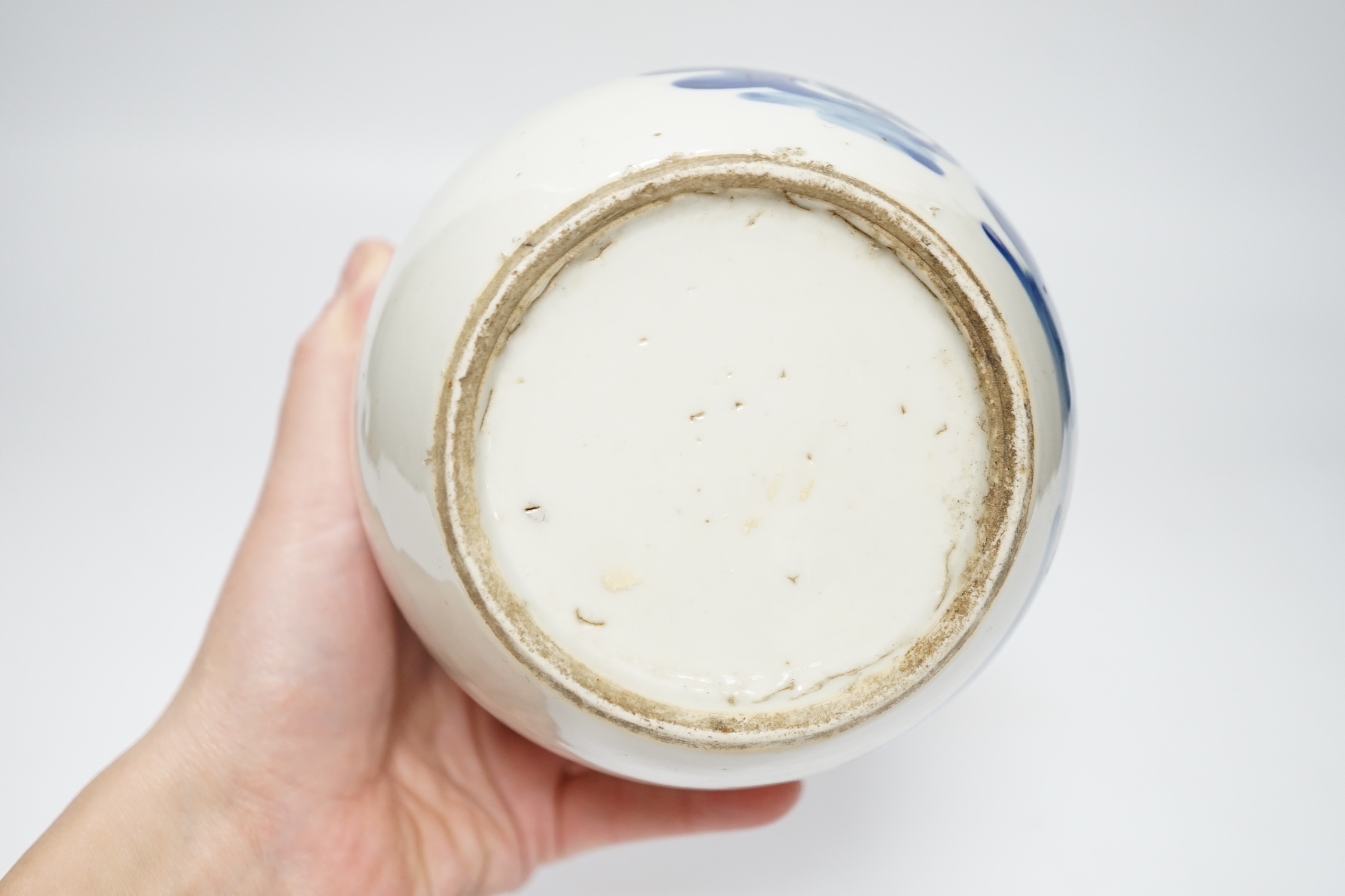 A Chinese blue and white jar, 19th century, with pierced hardwood lid, 15cm high